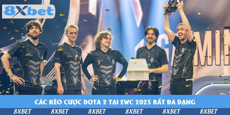 Đội tuyển Dota 2 mặc áo đồng phục ăn mừng, một thành viên giơ cao cúp giữa mưa pháo giấy