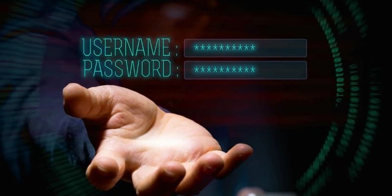Bàn tay mở ra bên dưới hai ô username và password được che bằng dấu sao trên nền tối